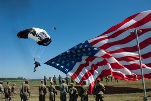 Gliding to the ground with SFC Bowman will also be an incredible 60-foot American flag.