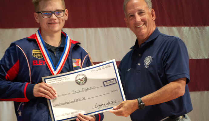 CMP Board Chairman & CEO Jerry O’Keefe presents Jack Ogoreuc with his award and check. Jack placed 1st in the Junior Olympics and 2nd overall in the CMP National Championship.