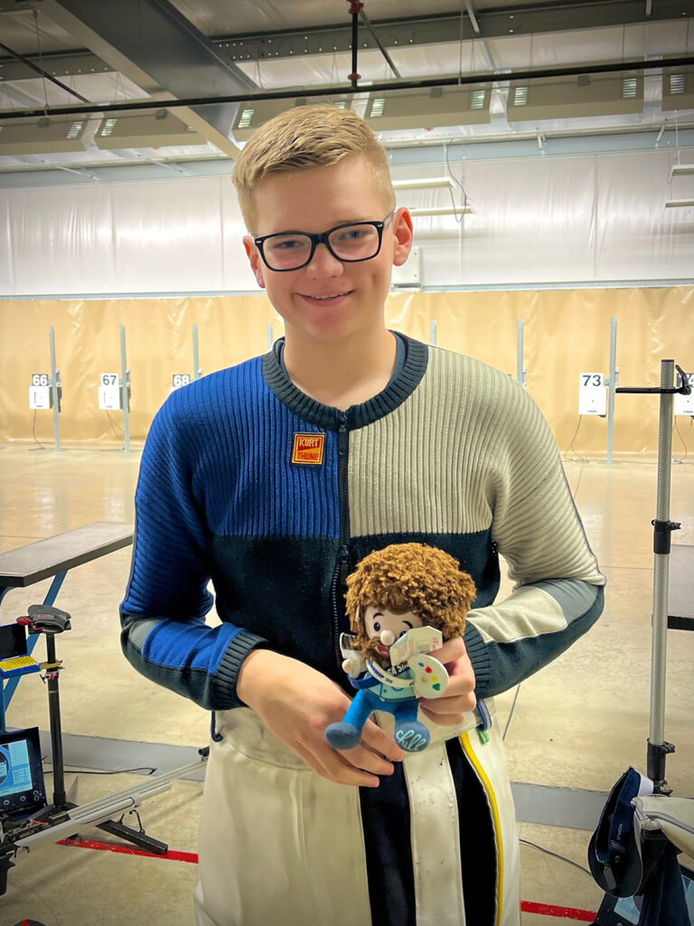 Many competitors have good luck charms. For Jack, it is a plush Bob Ross and it reminds him to ‘Shoot happy little tens’.